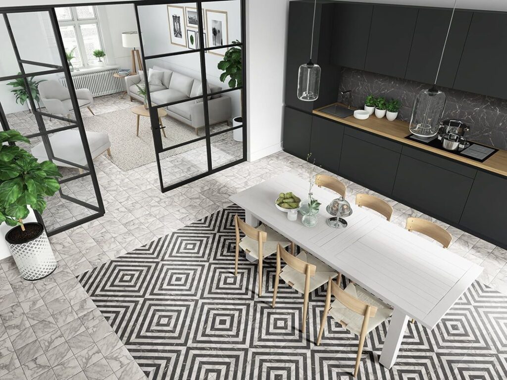 Modern kitchen and dining area with geometric patterned floor tiles and glass doors.