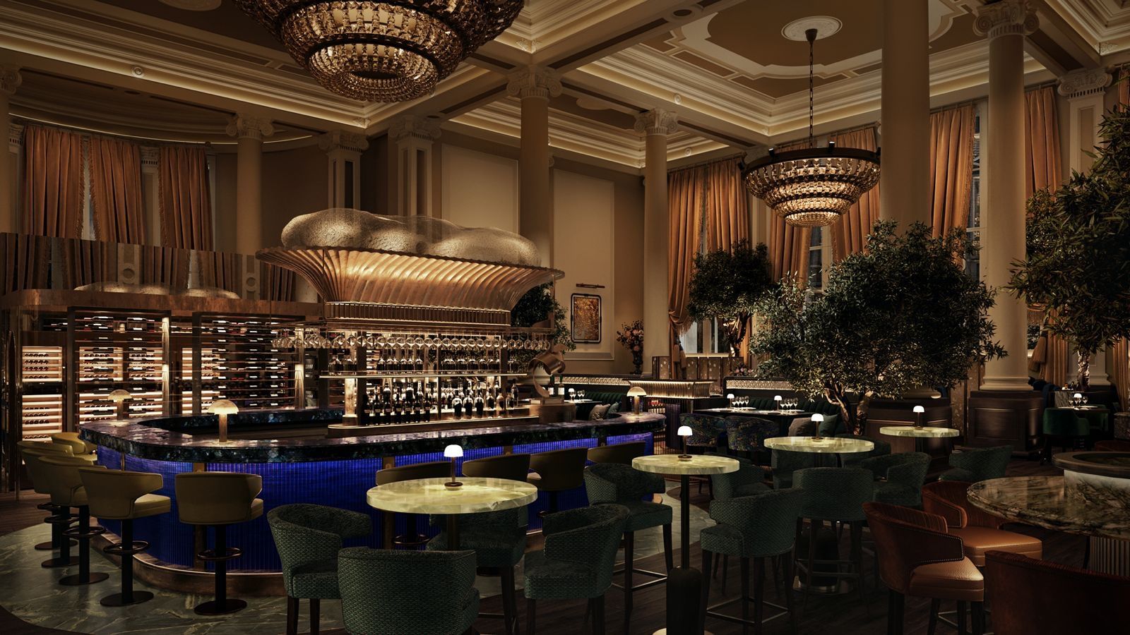 Elegant indoor bar with round tables, velvet chairs, chandeliers, and a central oval bar area.